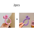 Set of 2 stretch rubber hair ties for women in pink and purple