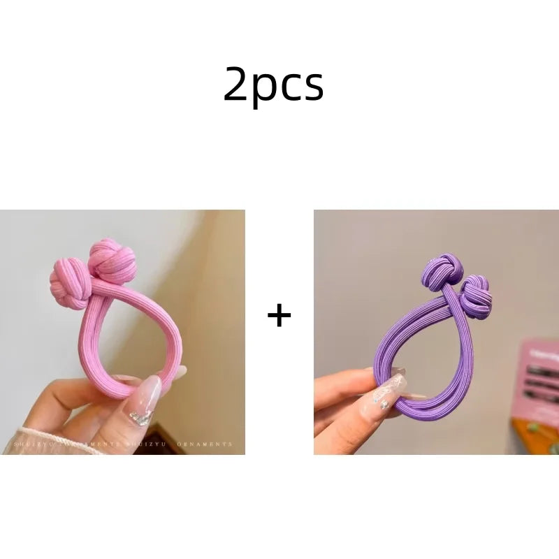 Set of 2 stretch rubber hair ties for women in pink and purple