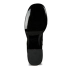 Bottom view of Rag Company stretch suede boots for women with a sleek black sole design