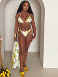Women's string bikini with lemon print, perfect for beach lounging