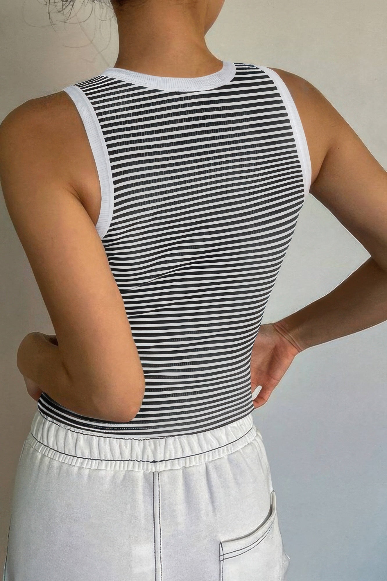 Back view of a striped crop tank top from VacationGrabs, perfect for summer styling