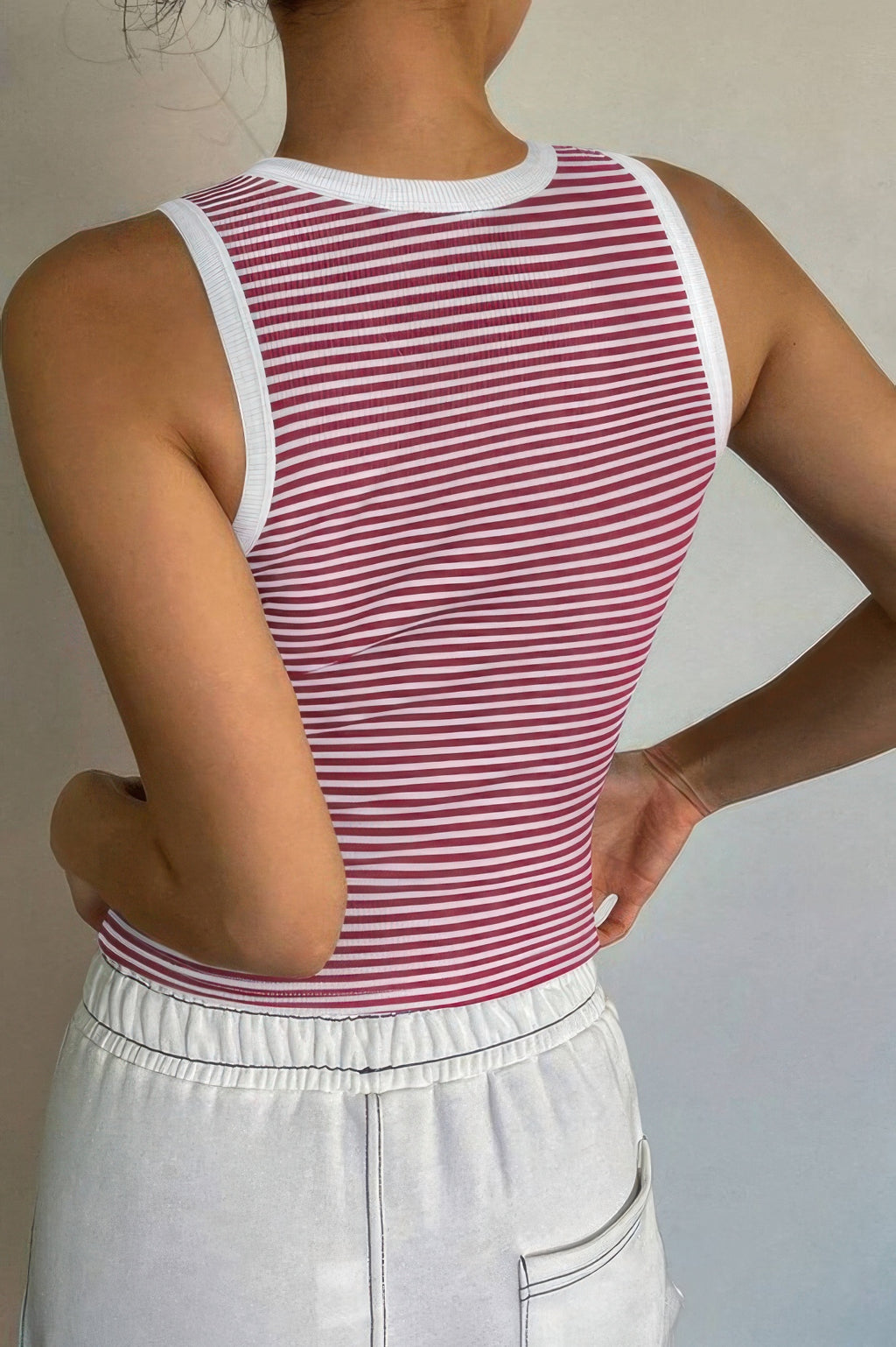 Back view of a Women's striped crop tank top by VacationGrabs, featuring a fitted design and white trim