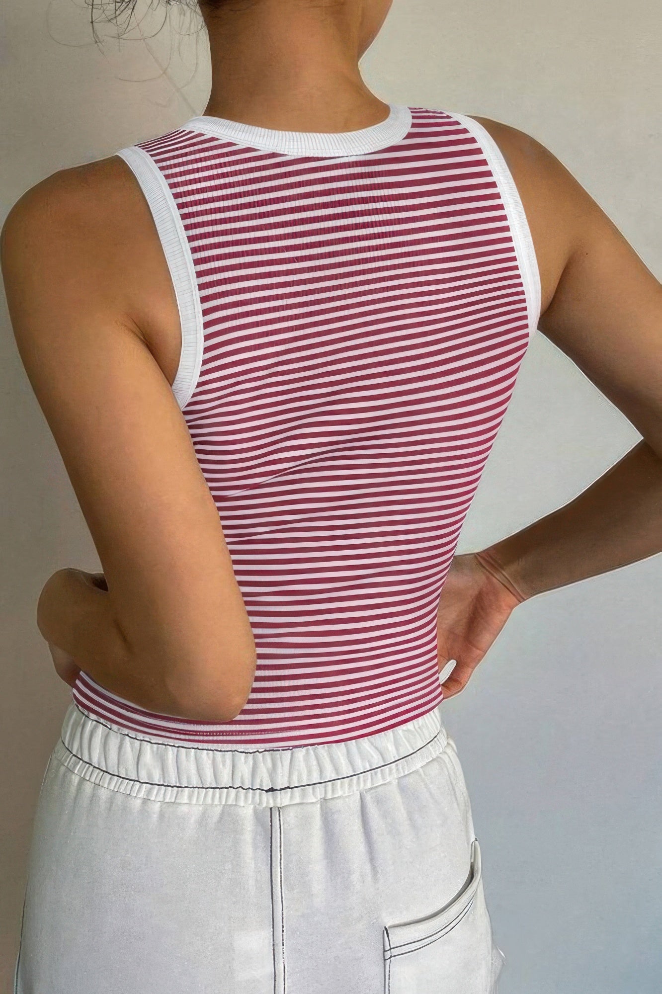 Back view of a Women's striped crop tank top by VacationGrabs, featuring a fitted design and white trim