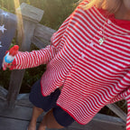 Woman wearing a striped Y2K knit cardigan with long sleeves