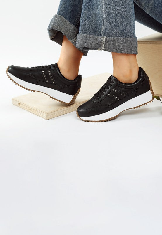 Women's studded real leather sneakers in black for casual wear