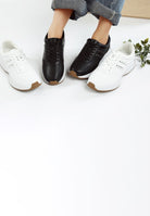 women's studded real leather sneakers in black and white for casual wear