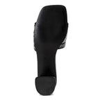 Bottom view of Rag Company women's studio 55 New York sandals showing black sole and heel