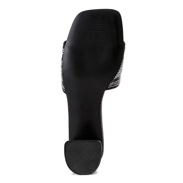 Bottom view of Rag Company women's studio 55 New York sandals showing black sole and heel