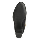 Sole of stylish ankle boots for women featuring a sleek design and durable grip for comfort