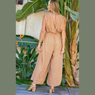 Davi & Dani women's jumpsuit with a backless design, stylish beachwear for women in a floral pattern