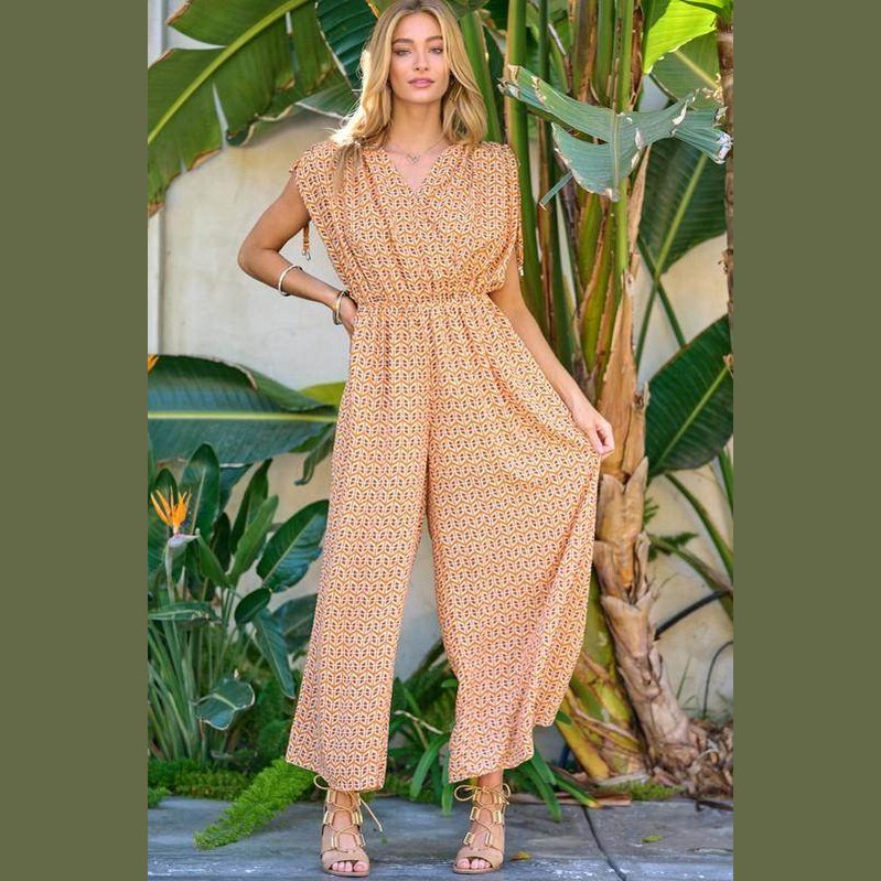 Davi & Dani stylish beachwear for women featuring a patterned jumpsuit with wide legs and flutter sleeves