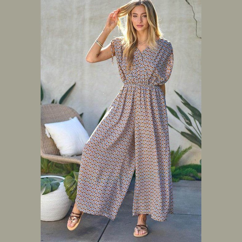 Davi & Dani stylish beachwear for women featuring a patterned jumpsuit with short sleeves and a relaxed fit