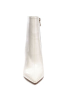 Stylish beige booties from Rag Company with a sleek design and pointed toe for a modern look