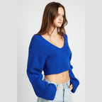 Stylish blue crop top by Emory Park featuring a V-neck and wide sleeves for a trendy look