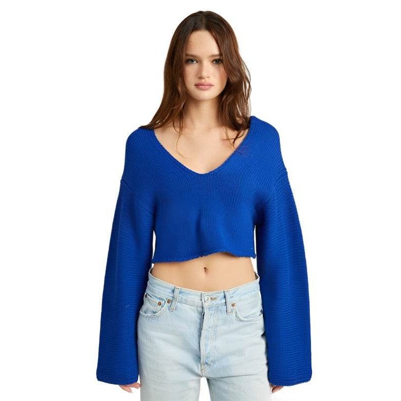 Stylish blue crop top with wide sleeves and a deep v-neck design, perfect for casual outfits