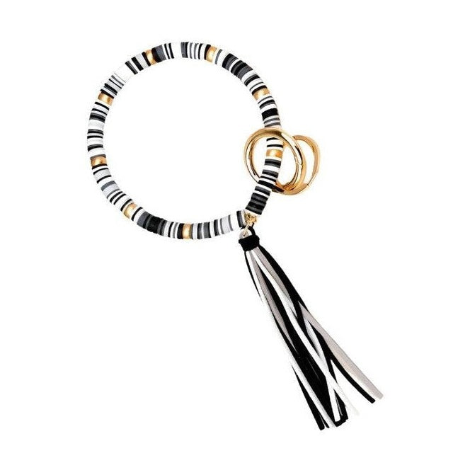 Aili's Corner stylish bracelet key holder with black and white stripes and a tassel accent