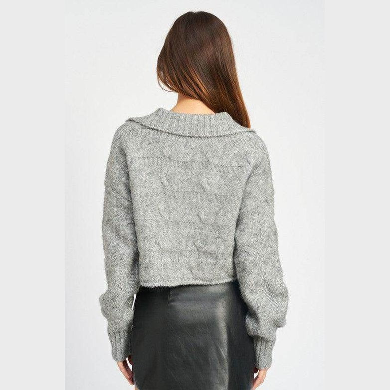 Back view of a stylish cableknit sweater in gray by Emory Park, perfect for cozy winter outfits