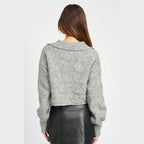 Back view of a stylish cableknit sweater in gray by Emory Park, perfect for cozy winter outfits