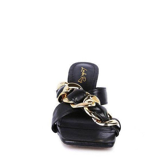 Stylish clear strap heels with a bold gold chain detail for a chic look