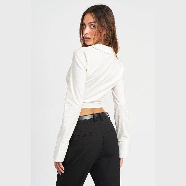 Emory Park stylish deep v neck blouse in cream, featuring a cropped fit and long sleeves