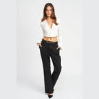 Emory Park stylish deep v neck blouse in white, perfect for pairing with high-waisted pants for a chic look.