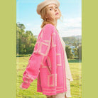 La Miel stylish knit cardigan in pink with geometric patterns, perfect for layering in cooler weather