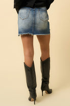 Back view of Insane Gene stylish mini skirt for women in faded denim with frayed hem