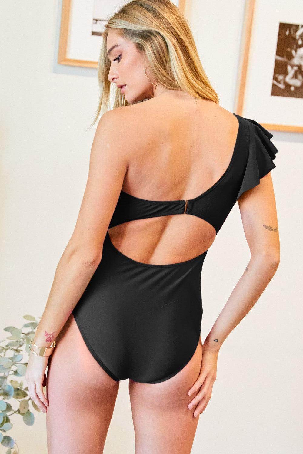 Davi & Dani stylish one piece bathing suit in black with ruffle detail and open back design