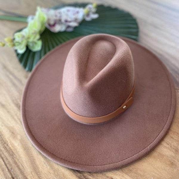 Stylish panama hat in brown with a leather band, perfect for enhancing any outfit