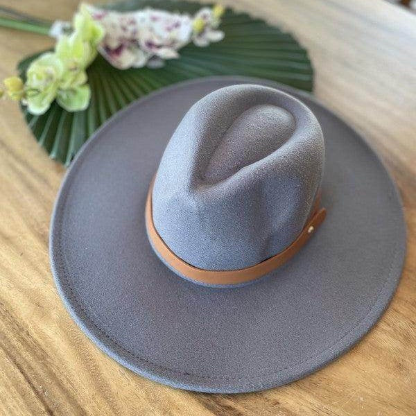 Stylish panama hat in gray with a brown leather band for fashionable women's accessories