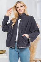 Stylish quilted coat from Orange Farm Clothing with a relaxed fit and contrasting trim for women