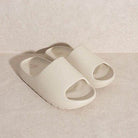 Stylish slip-on sandals in light beige color with open toe design for casual comfort
