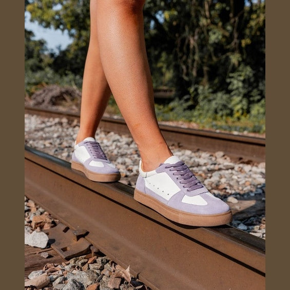 Maker's Shoes women's stylish sneakers for vacations in white and purple walking on railway track