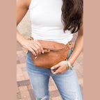 Aili's Corner stylish travel waist pack in tan leather, perfect for hands-free convenience while traveling