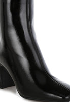Rag Company stylish vacation boots for women featuring a sleek black design and pointed toe