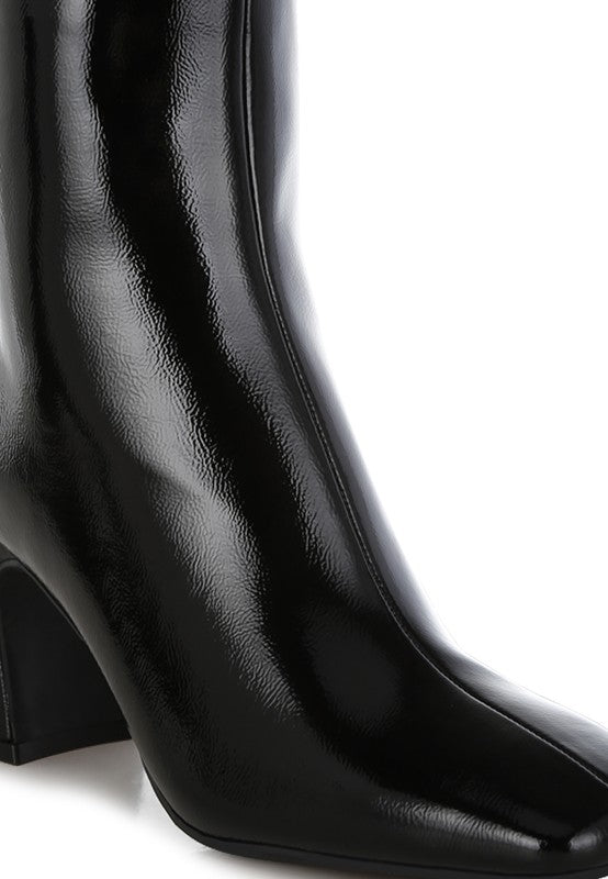 Rag Company stylish vacation boots for women featuring a sleek black design and pointed toe