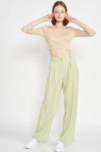 Emory Park stylish vacation crop top in beige paired with light green pants for a trendy summer look