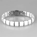 Stylish vacation jewelry for women, featuring a sleek white bracelet with a metallic clasp