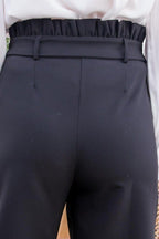Close-up of black stylish vacation pants for women with a gathered waistband and belt loops