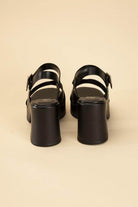 Fortune Dynamic black stylish vacation sandals with a chunky heel and adjustable strap for comfort