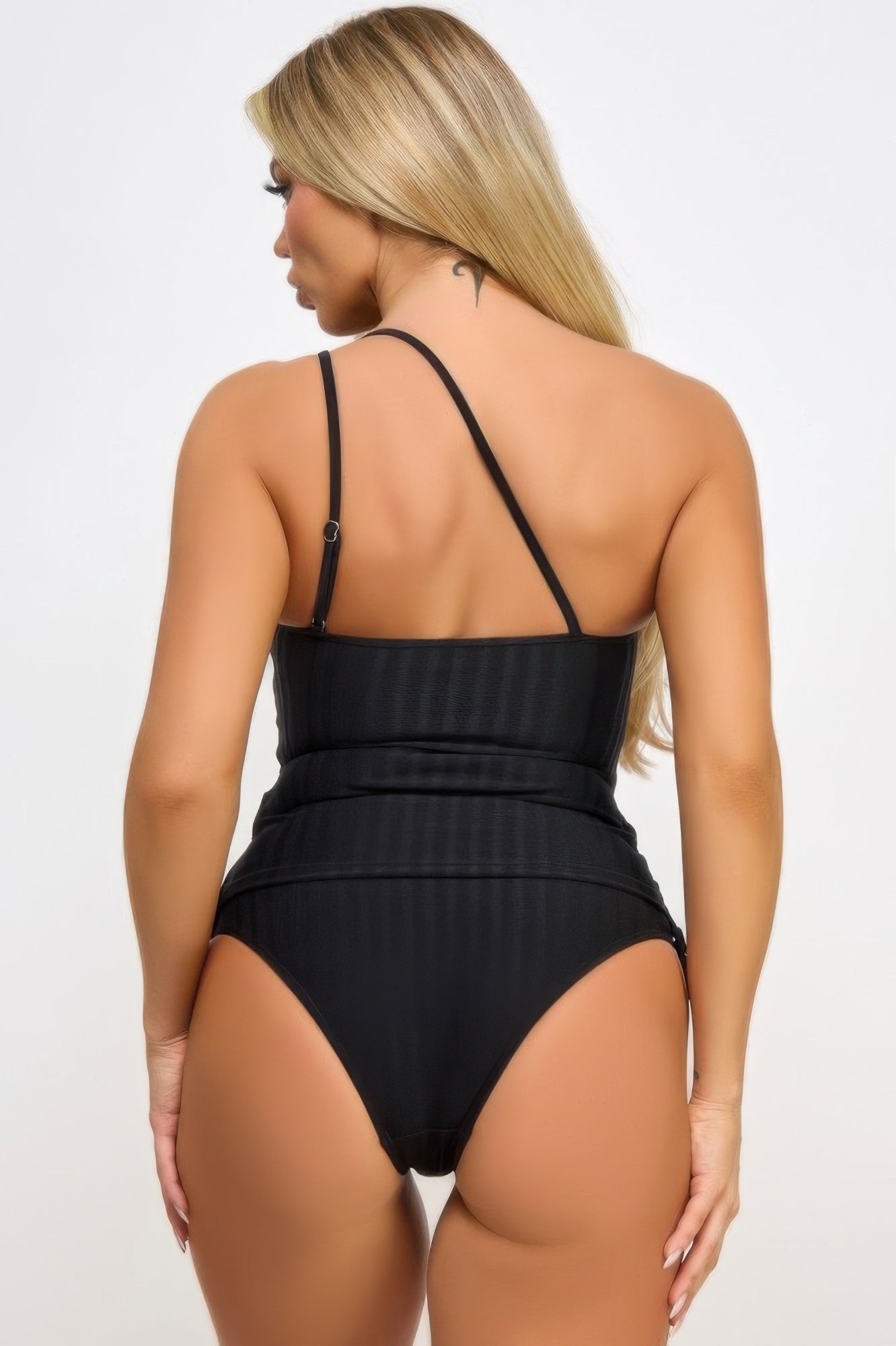 Back view of stylish vacation swimwear for women featuring a sleek black two-piece design