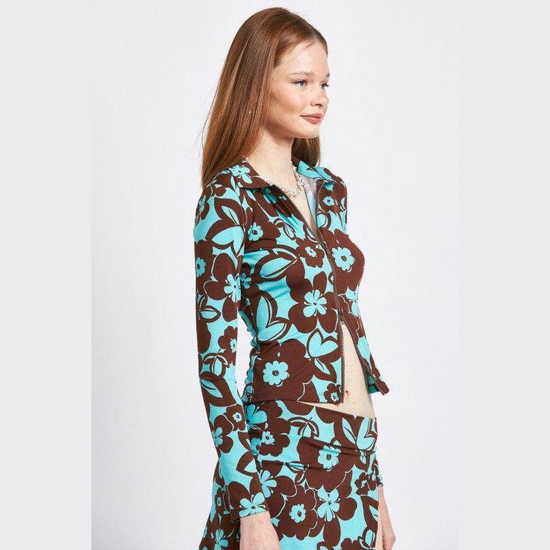 Emory Park stylish vacation top featuring a floral pattern in turquoise and brown colors
