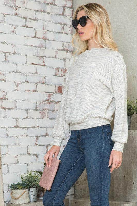 Stylish vacation tops for women by Andante USA, featuring a light sweater with balloon sleeves and a relaxed fit