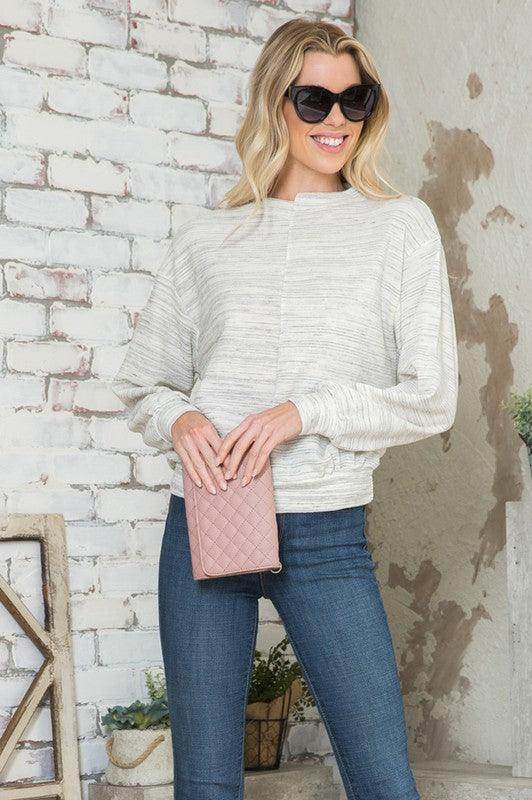 Light gray Andante USA women's shirt, a stylish vacation top for women, paired with jeans and sunglasses
