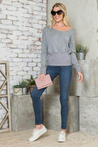 Stylish Vacation Tops Women, featuring a gray long-sleeve shirt with a relaxed fit and cozy design