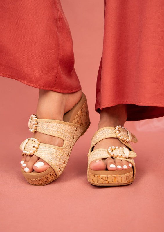 Stylish wedge sandals with straps in beige cork design by Maker's Shoes on model feet