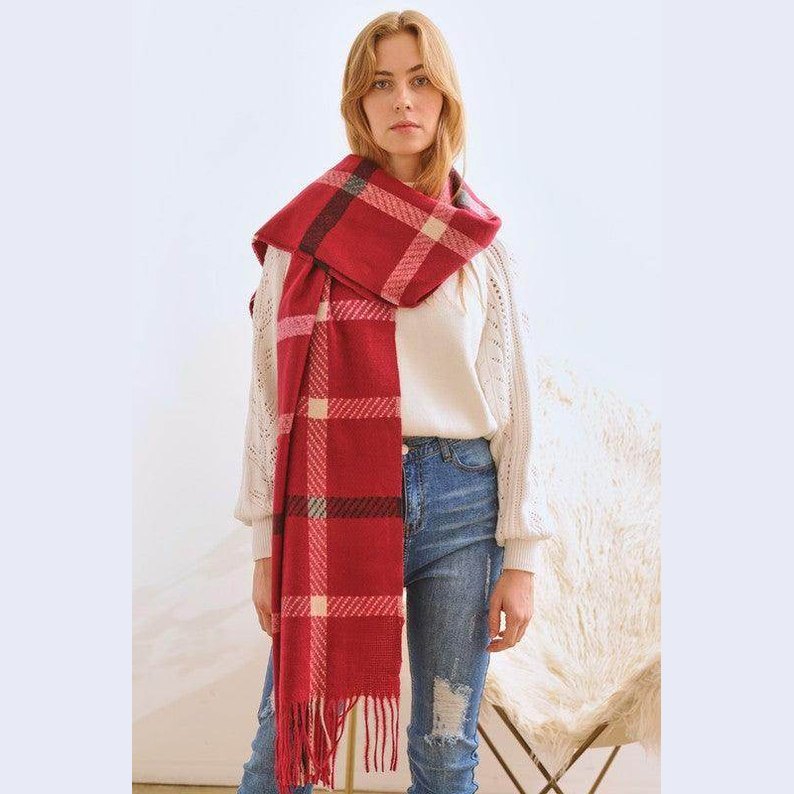 Bella Chic stylish winter scarf for vacations in red plaid pattern layered over a cozy outfit