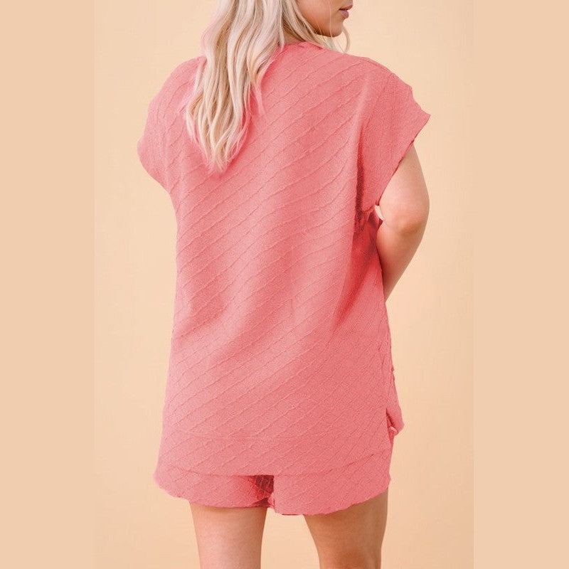 Back view of woman wearing pink textured summer casual drawstring shorts outfit by SHEWIN INC