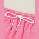 Pink textured shorts waistband with white drawstring for summer casual drawstring shorts outfit