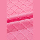 Close-up of pink textured fabric for summer casual drawstring shorts outfit by SHEWIN INC.